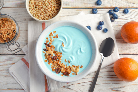 Flat lay composition with spirulina smoothie on wooden tableの写真素材