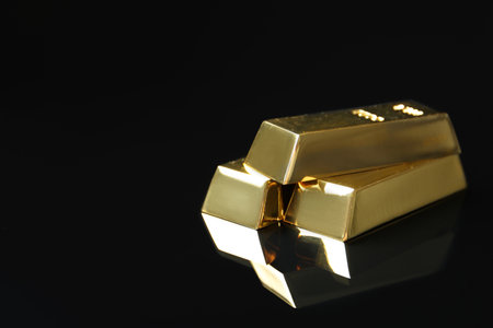 Shiny gold bars on black background. Space for textの写真素材