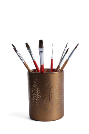 Holder with different paint brushes on white backgroundの写真素材
