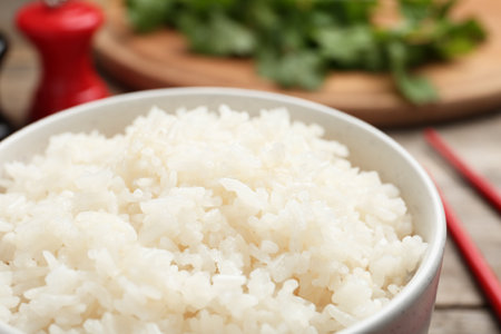 Bowl of boiled rice on table, closeupの写真素材