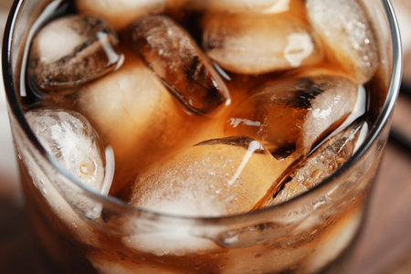 Glass of tasty refreshing cola with ice cubes, closeupの写真素材