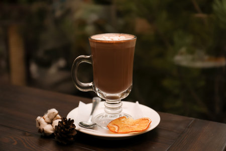 Cup of aromatic cacao on table against blurred backgroundの写真素材