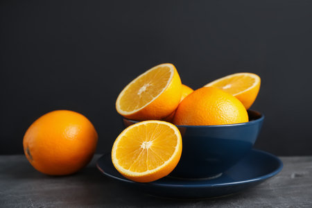 Fresh oranges in bowl on table. healthy fruitsの写真素材