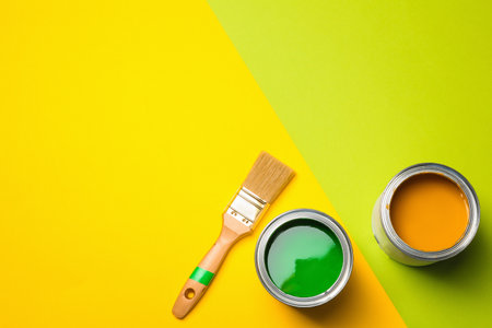Flat lay composition with paint cans and space for text on color backgroundの写真素材