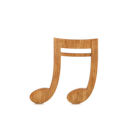 Brown wooden music note isolated on whiteの写真素材