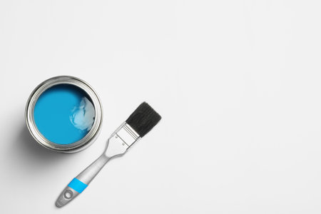 Paint can and brush on white background, top view. Space for textの写真素材