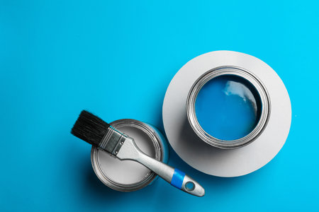 Flat lay composition with paint cans and space for text on color backgroundの写真素材