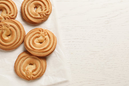 Danish butter cookies on wooden table, top view. Space for textの写真素材
