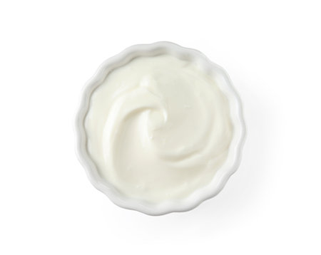 Bowl with creamy yogurt on white background, top viewの写真素材