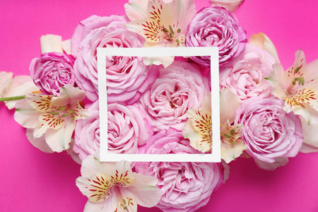 Frame with flowers on color background, top view. Space for textの写真素材