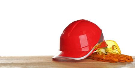 Set of safety equipment on table against white backgroundの写真素材