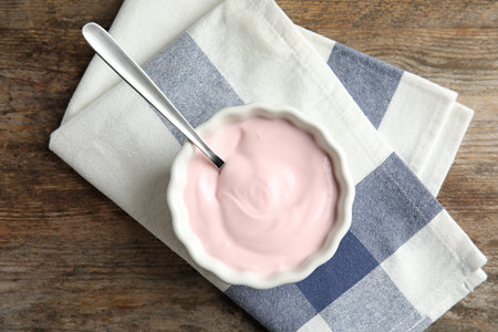 Bowl with creamy yogurt served on table, top viewの写真素材