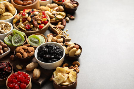 Composition of different dried fruits and nuts on color background. Space for textの写真素材