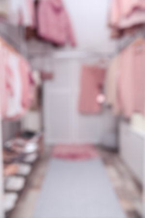 Blurred view of modern dressing room with different stylish clothes and accessoriesの写真素材