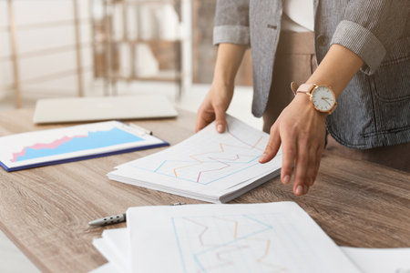 Businesswoman working with documents at office table, closeupの写真素材
