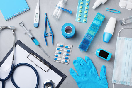 Flat lay composition with medical objects on gray backgroundの写真素材
