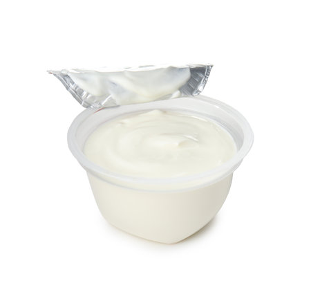Plastic cup with creamy yogurt on white backgroundの写真素材