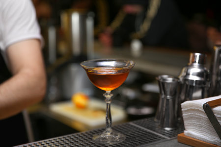 Glass of tasty cocktail on bar counterの写真素材