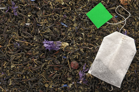 Tea bag on dry leaves, top view with space for textの写真素材