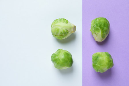 Fresh Brussels sprouts on color background, flat lay. Space for textの写真素材