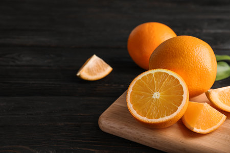 Fresh juicy oranges on wooden table. Space for textの写真素材