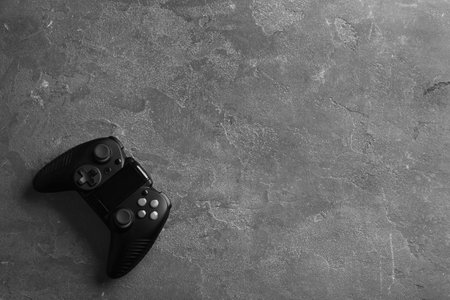 Modern video game controller on gray background, top view with space for textの写真素材
