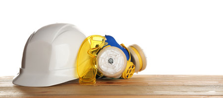 Set of safety equipment on table against white backgroundの写真素材