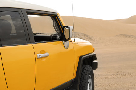 Modern car in desert ready for dune bashingの写真素材