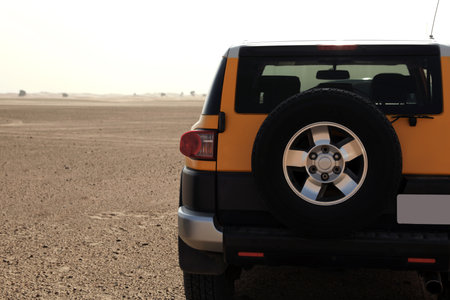 Modern car in desert ready for dune bashingの写真素材