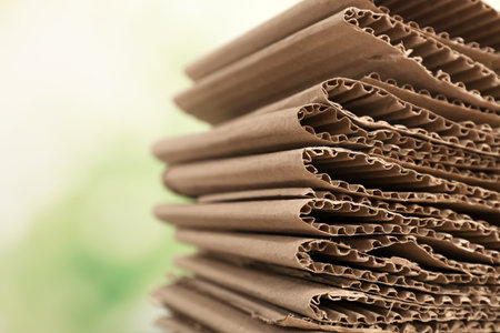 Stack of cardboard for recycling on blurred background, closeupの写真素材