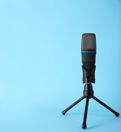 Professional condenser microphone on color background, space for textの写真素材