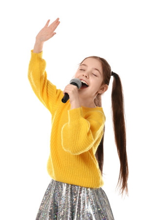 Little girl singing into microphone on white backgroundの写真素材
