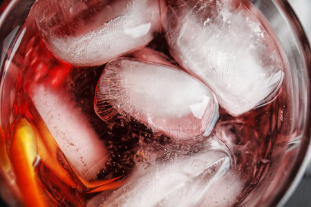 Refreshing cocktail with ice cubes in glass, top viewの写真素材