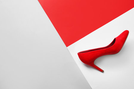 Stylish high heel shoe on color background, top view with space for textの写真素材