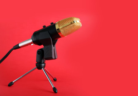 Condenser microphone on color background, space for textの写真素材