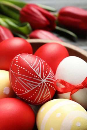 Bowl with painted Easter eggs on table, closeupの写真素材