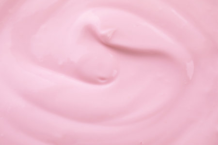 Delicious creamy yogurt as background, closeup viewの写真素材