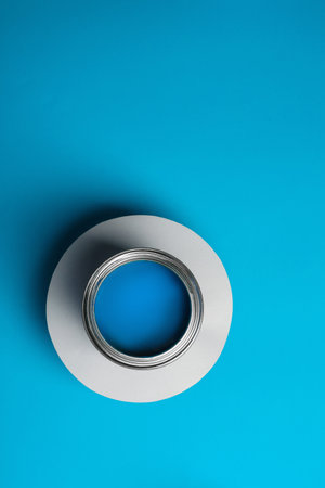 Paint can on color background, top view. Space for textの写真素材