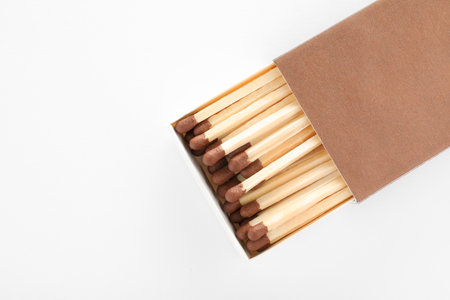 Cardboard box with matches on white background, top view. space for design
