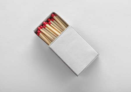 Cardboard box with matches on white background, top view. space for designの写真素材