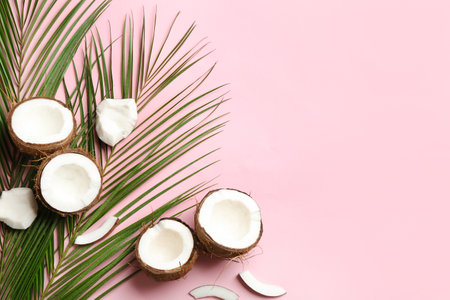 Flat lay composition with coconuts and space for text on color background