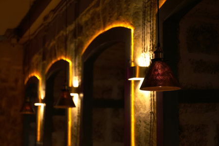 Different lamps with glowing light bulbs indoorsの写真素材