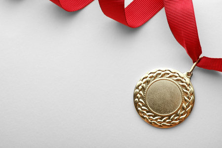 Gold medal on white background, top view with space for text. symbol of victoryの写真素材