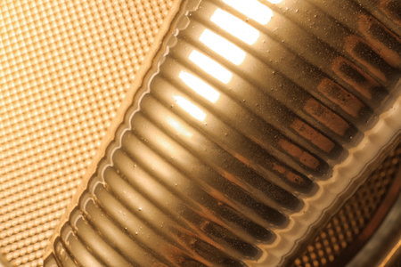 Golden cup on blurred background, closeup viewの写真素材