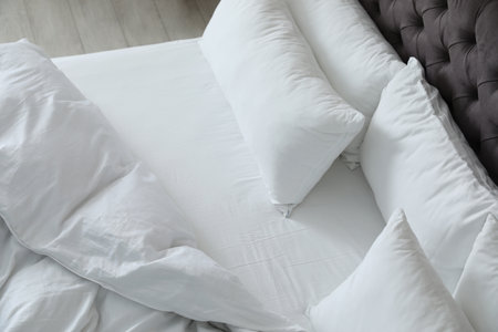 Soft white pillows on comfortable bed. interior designの写真素材