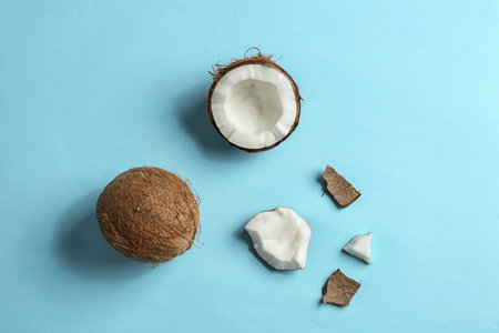 Flat lay composition with coconuts on color backgroundの写真素材