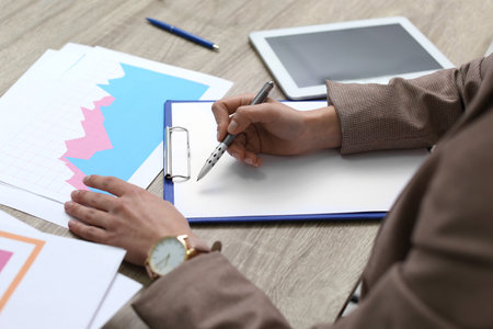 Businesswoman working with documents at office table, closeupの写真素材