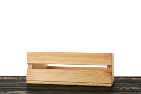 Empty rustic wooden crate on table against white backgroundの写真素材