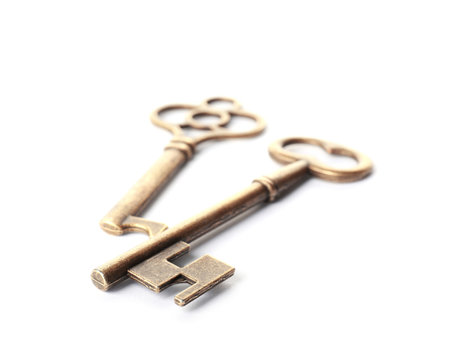 Bronze vintage ornate keys on white backgroundの写真素材