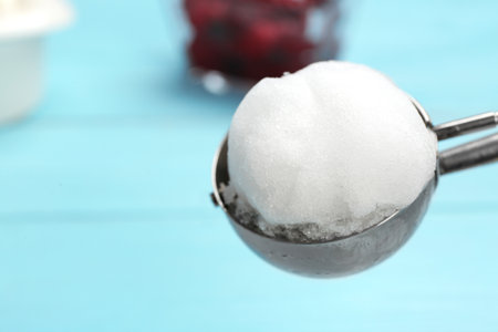 Scoop with snow ice cream ball against color background, closeup. Space for textの写真素材